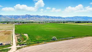 View of mountain background featuring rural landscape