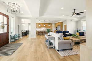 Entry way featuring recessed lighting, light wood-style flooring, a chandelier, and a ceiling fan