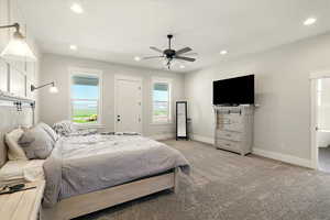 Carpeted bedroom with a ceiling fan, recessed lighting, and access to outside