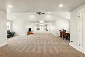 Bonus room with healthy amount of natural light, light colored carpet, lofted ceiling, recessed lighting, and ceiling fan