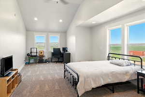 Bedroom with lofted ceiling, a desk, carpet, recessed lighting, and ceiling fan