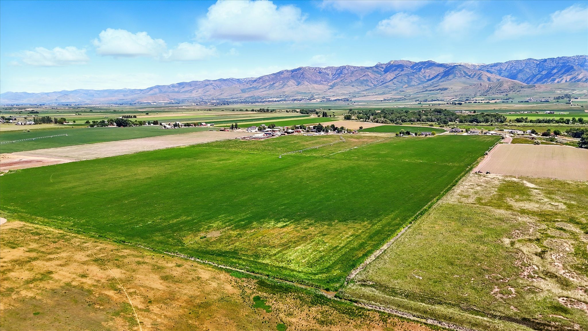 View of mountain backdrop featuring rural landscape and farmland