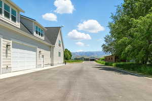 View of asphalt driveway featuring a mountain view