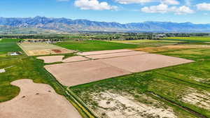 View of mountain background featuring extensive farmland and rural landscape