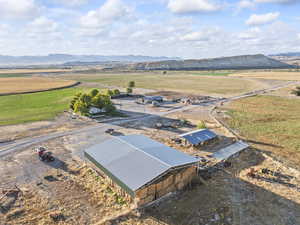 Overview of rural landscape featuring a mountain backdrop