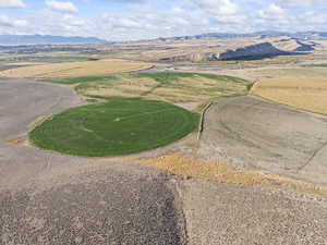 Aerial view of sparsely populated area featuring a mountain backdrop