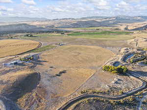 Aerial view of property's location with a mountainous background and rural landscape
