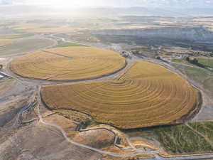 Aerial overview of property's location with a mountainous background and rural landscape