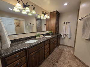Bathroom featuring double vanity and recessed lighting