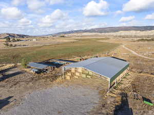 Aerial view of sparsely populated area featuring a mountain backdrop