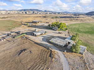 Overview of rural landscape featuring a mountain backdrop