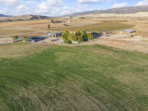 Overview of rural landscape featuring a mountain backdrop