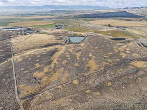 Aerial view of sparsely populated area featuring a mountain backdrop