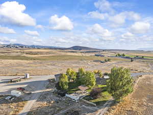 View of mountain backdrop featuring rural landscape