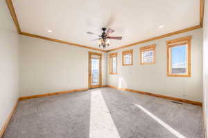Spare room with carpet floors, ornamental molding, a ceiling fan, and recessed lighting