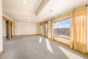 Empty room with carpet flooring