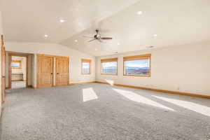 Unfurnished bedroom with carpet floors, vaulted ceiling, recessed lighting, and a ceiling fan