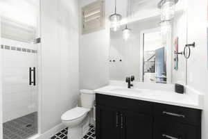 Bathroom with vanity and a shower stall