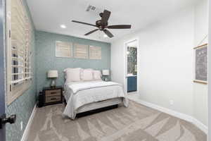 Bedroom featuring wallpapered walls, recessed lighting, carpet floors, ceiling fan, and connected bathroom