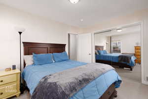 Bedroom with carpet floors and a closet