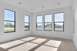 Unfurnished room featuring light wood-type flooring and recessed lighting