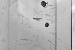 Bathroom view of a tile shower