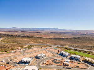 Drone / aerial view of a mountain backdrop and a desert landscape