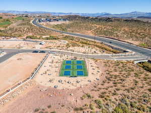 Aerial view of a mountain backdrop and a desert landscape