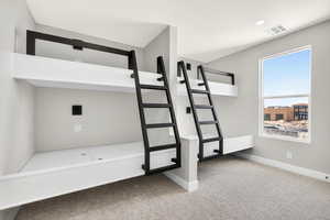 Unfurnished bedroom featuring carpet flooring and baseboards