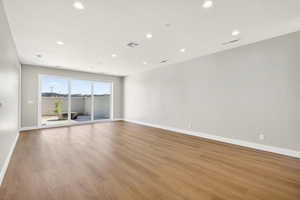 Unfurnished room featuring light wood finished floors and recessed lighting