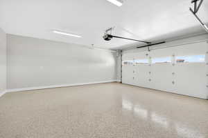 Garage featuring a garage door opener