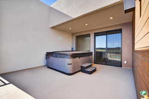 View of patio / terrace featuring a hot tub