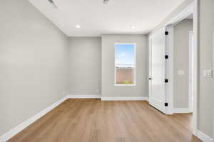 Unfurnished room featuring light wood-type flooring and recessed lighting