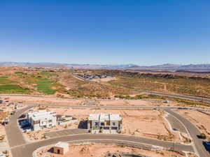 Drone / aerial view of a mountainous background and a desert landscape