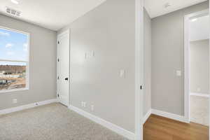 Unfurnished room featuring light colored carpet and recessed lighting