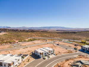 Aerial view of a mountain backdrop and a desert landscape
