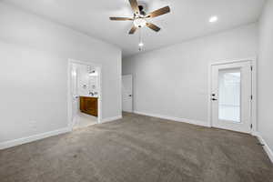 Unfurnished bedroom with light carpet, recessed lighting, a ceiling fan, and ensuite bathroom