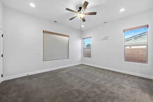 Carpeted spare room featuring recessed lighting and a ceiling fan