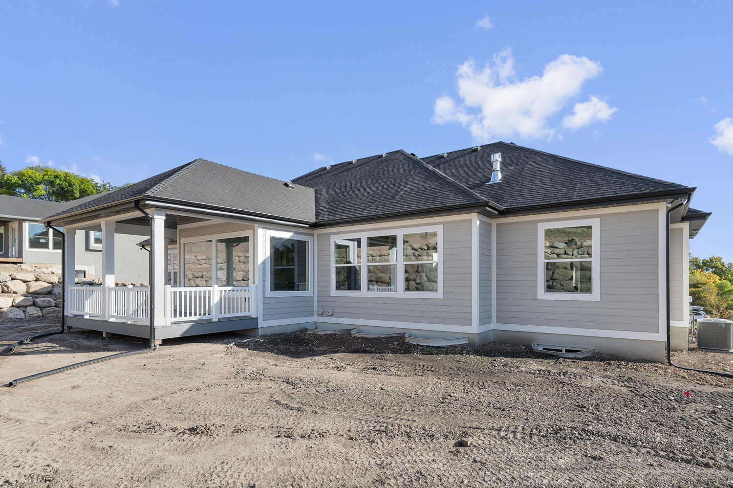 Rear view of property with roof with shingles and a wooden deck