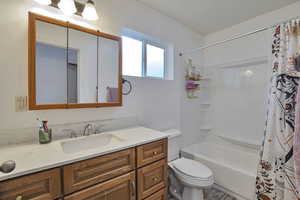 Full bath with vanity and shower / bathtub combination with curtain