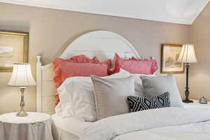 Bedroom featuring crown molding