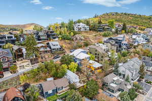 Aerial perspective of suburban area with a mountain backdrop