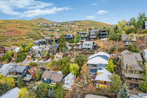 Aerial view of residential area featuring a mountainous background