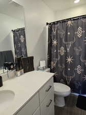 Bathroom featuring vanity,  and curtained shower
