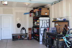 Garage featuring a garage door opener