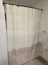 Full bath featuring a shower connected to owners' bedroom