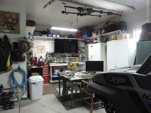 Garage featuring a workshop area