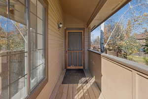 Balcony featuring a sunroom