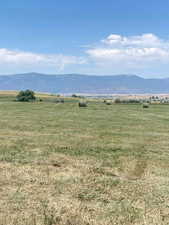 View of mountain backdrop featuring rural landscape