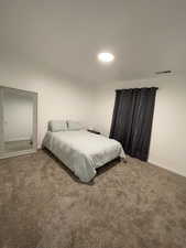 Bedroom featuring carpet flooring